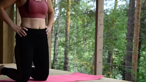 Active female  practicing meditation and yoga doing stretching exercise Stock Footage 301548622