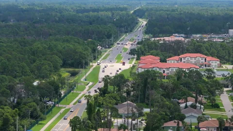 Active fire rescue vehicle moving along Florida roadway, emergency signals Stock Footage 329142762