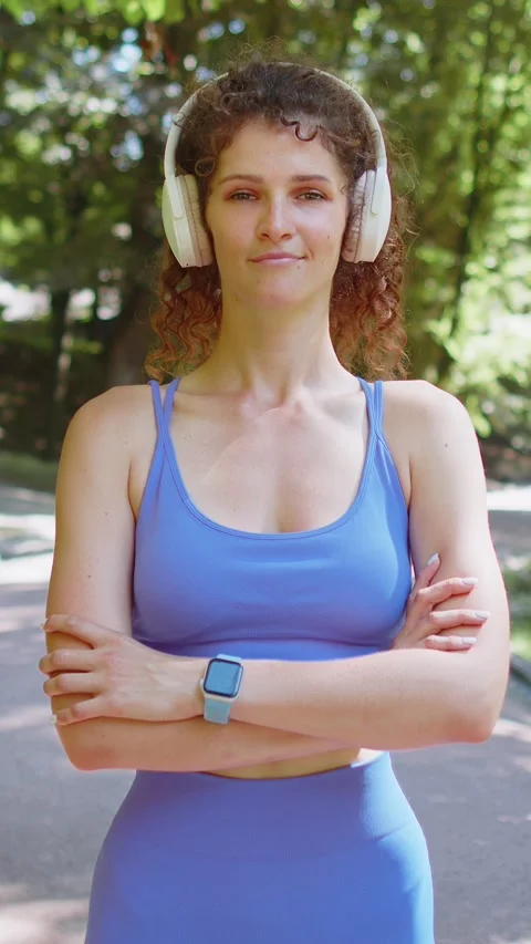 Active fit runner woman training looking at camera, happy about marathon Stock Footage 333459115