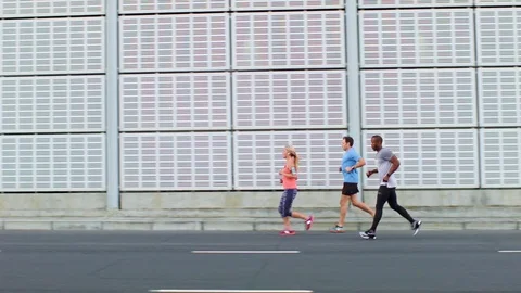 Active friends road running in group Stock Footage 71624778