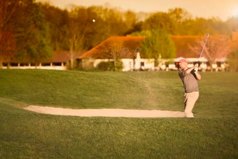 Active golfer at bunker. Stock Photos