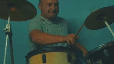 Active handsome drummer drumming at studio. Video stock 83886299