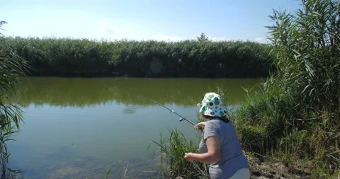 Active happy and healthy elderly European woman  fishing 스톡 동영상 141647752