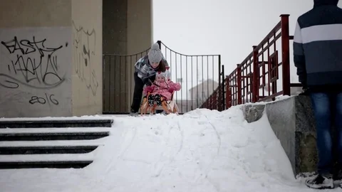 Active Happy Children Sledding and Enjoying Winter Snowy Day in Slow Motion 動画素材 71272559