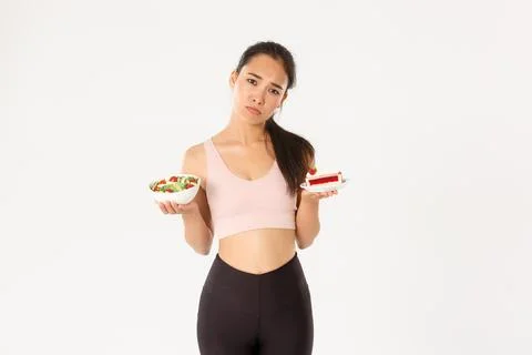 Active lifestyle, fitness and wellbeing concept. Gloomy and sad cute asian girl Stock Photos