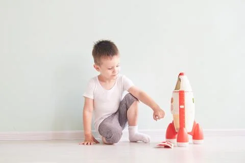 Active little boy playing the rocket toys, Child showing rocket toy with happy Stock Photos