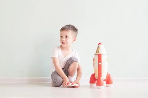 Active little boy playing the rocket toys, Child showing rocket toy with happy Stock Photos