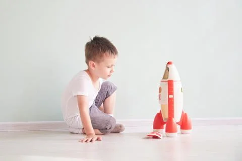 Active little boy playing the rocket toys, Child showing rocket toy with happy Stock Photos