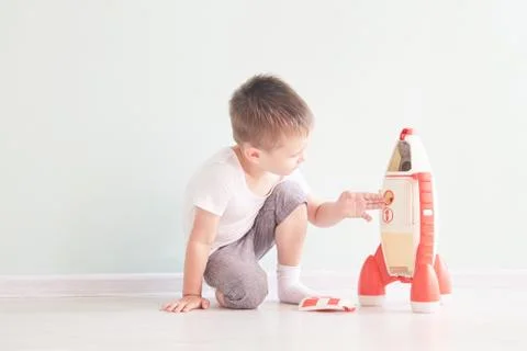 Active little boy playing the rocket toys, Child showing rocket toy with happy Stock Photos