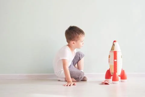 Active little boy playing the rocket toys, Child showing rocket toy with happy Stock Photos