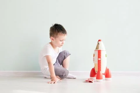 Active little boy playing the rocket toys, Child showing rocket toy with happy Stock Photos