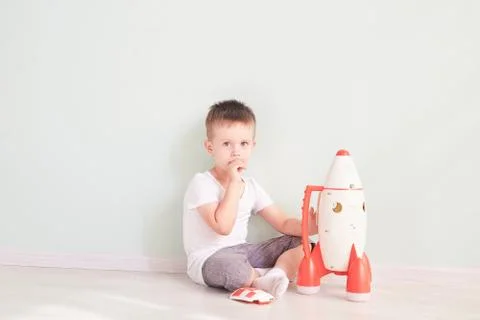 Active little boy playing the rocket toys, Child showing rocket toy with happy Stock Photos