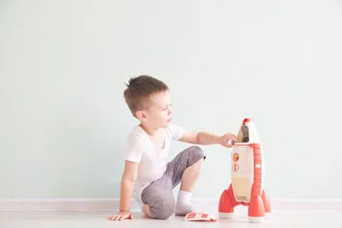 Active little boy playing the rocket toys, Child showing rocket toy with happy Stock Photos