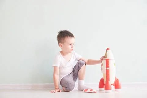 Active little boy playing the rocket toys, Child showing rocket toy with happy Stock Photos