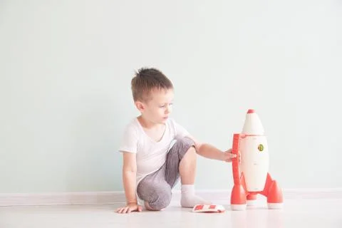 Active little boy playing the rocket toys, Child showing rocket toy with happy Stock Photos