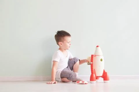 Active little boy playing the rocket toys, Child showing rocket toy with happy Stock Photos