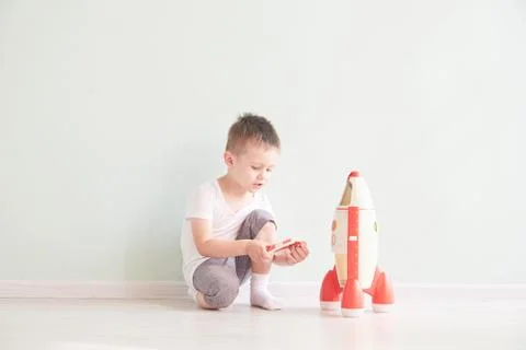 Active little boy playing the rocket toys, Child showing rocket toy with happy Stock Photos