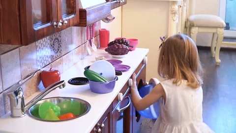 Active little preschool age child, cute toddler girl with blonde curly hair Stock Footage 75800984