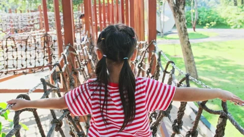 Active little sisters having fun in the outdoor playground in the park. Stock Footage 165716755