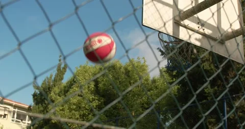 Active male basketball player practicing ball handling skill, dribbling ball Stock Footage 244114267