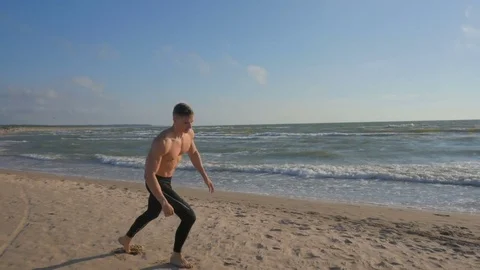 Active man exercising at the beach Video stock 84042145