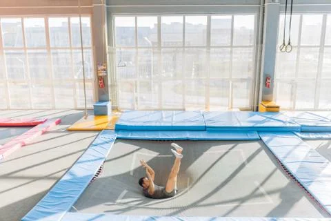 Active man is going to do a somersault Stock Photos