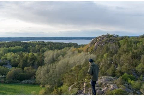 Active man hiking in the mountains viewing the landscape Stock Photos