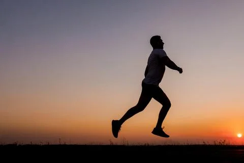 Active man running during sunset 스톡 사진