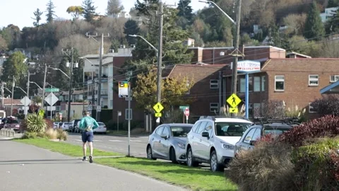 Active Man Running At Promenade Along Alki Beach On A Sunny Morning In Stock Footage 143516115