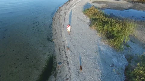Active man runs on the sandy beach Video stock 67866475