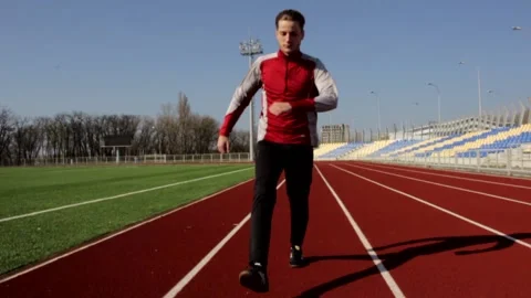 Active man walking doing squat warming up stretching outdoor workout slow motion Stock Footage 137542729