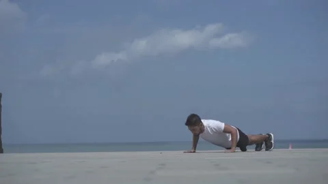Active Man Workout at The Beach Push Ups Pull Ups Stock Footage 163085858