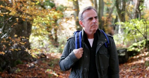Active Mature Man Walking Through Autumn Woodland In Slow Motion Stock Footage 119952933