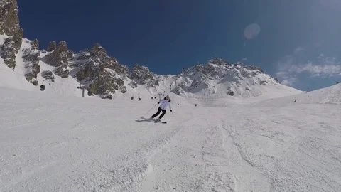 Active Mature Skier Skiing Down From The Mountain Slopes In Winter On Alpine Ski Stock Footage 94139272