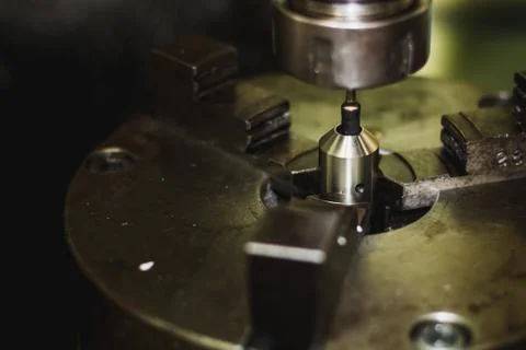 Active milling machine during processing part of engine Stock Photos