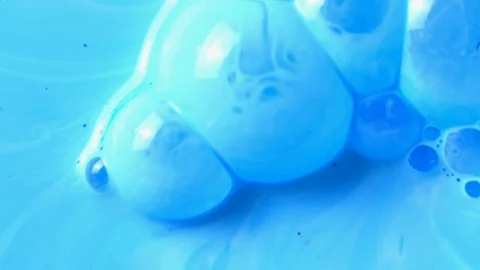 Active mixing of blue and white acrylic Stock Footage 104844636