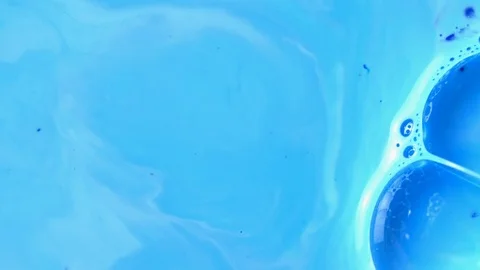 Active mixing of blue and white acrylic Stock Footage 105847749