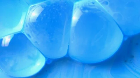 Active mixing of blue and white acrylic Stock Footage 105848200