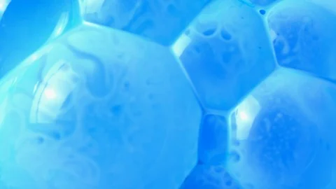 Active mixing of blue and white acrylic Stock Footage 105849367