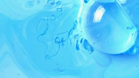 Active mixing of blue and white acrylic Stock Footage 106080539