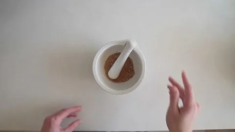 Active mixing of spices in a mortar Stock Footage 169835060