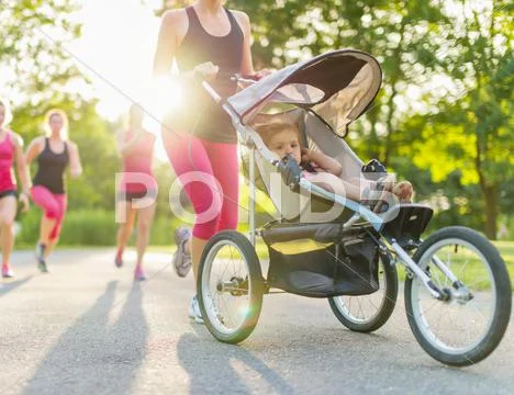 Active mother jogging Stock Photos