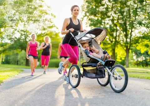 Active mother jogging Stock Photos