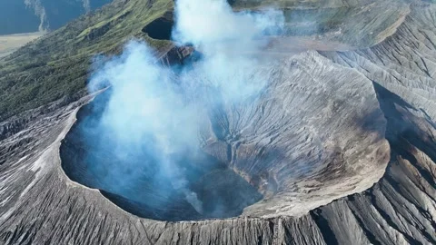 Active Mount Bromo volcano blowing smoke into the air in Java Indonesia 스톡 동영상 329360550