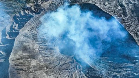 Active Mount Bromo volcano blowing smoke into the air in Java Indonesia Stock Photos