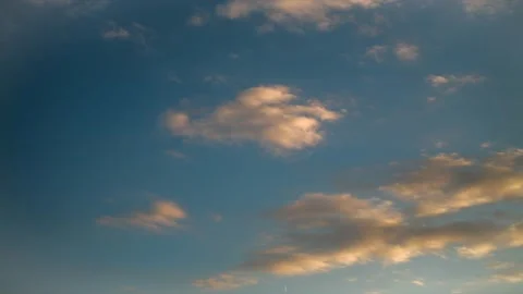 Active movement of clouds across the blue evening sky. Time lapse. Stock Footage 162797577