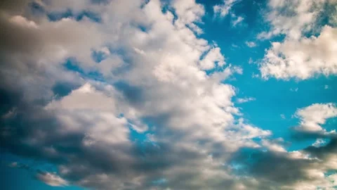 Active movement of clouds across the blue evening sky. Time lapse. Stock Footage 163759892