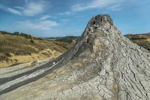 Active mud volcano with cracked soil captured in Romania Stock Photos