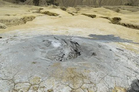 Active mud volcano crater. Mud Volcanoes (Vulcanii Noroiosi) geological reser Stock Photos