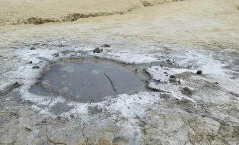 Active mud volcano crater. Mud Volcanoes (Vulcanii Noroiosi) geological reser Stock Photos